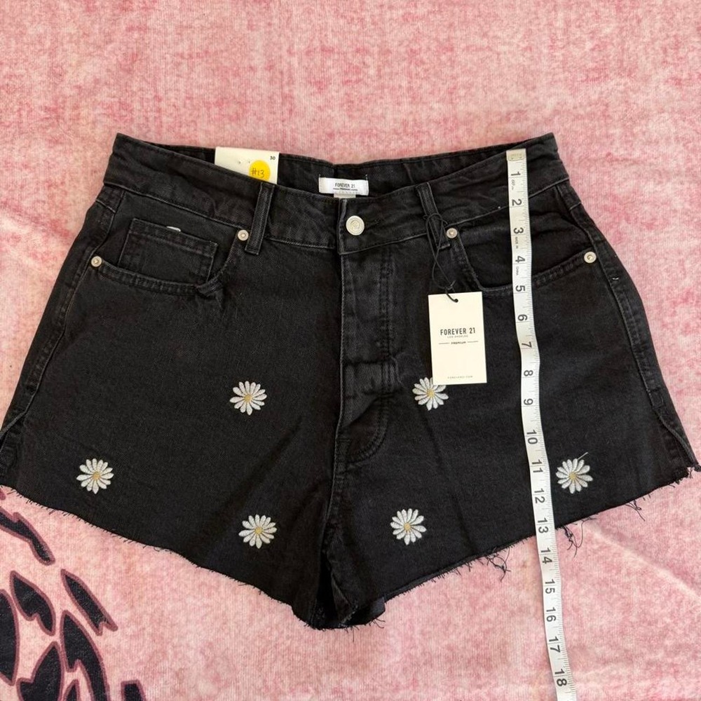 Forever 21 black denim shorts with white daisy embroidery